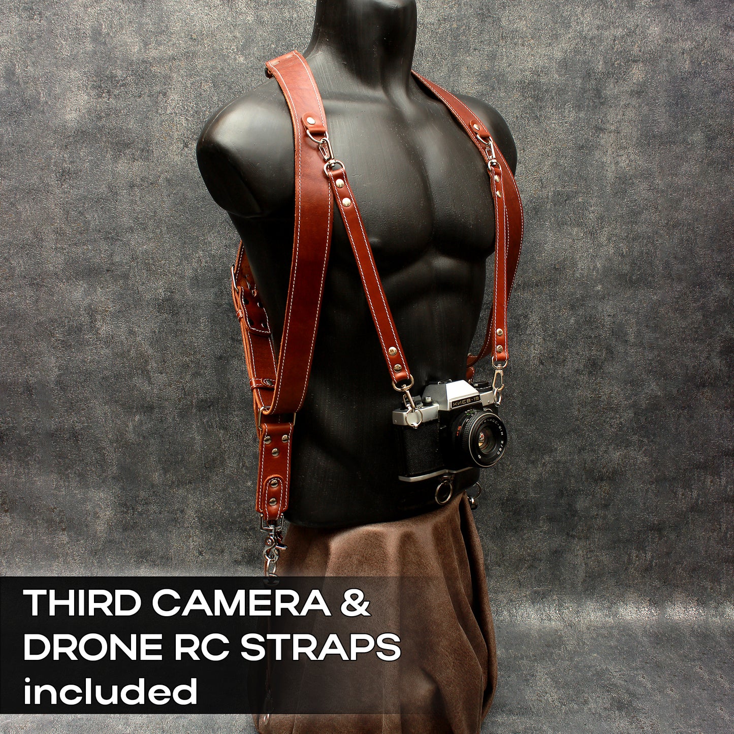 Dual camera strap (FULL LEATHER) with removable battery cases and a set of additional accessories.