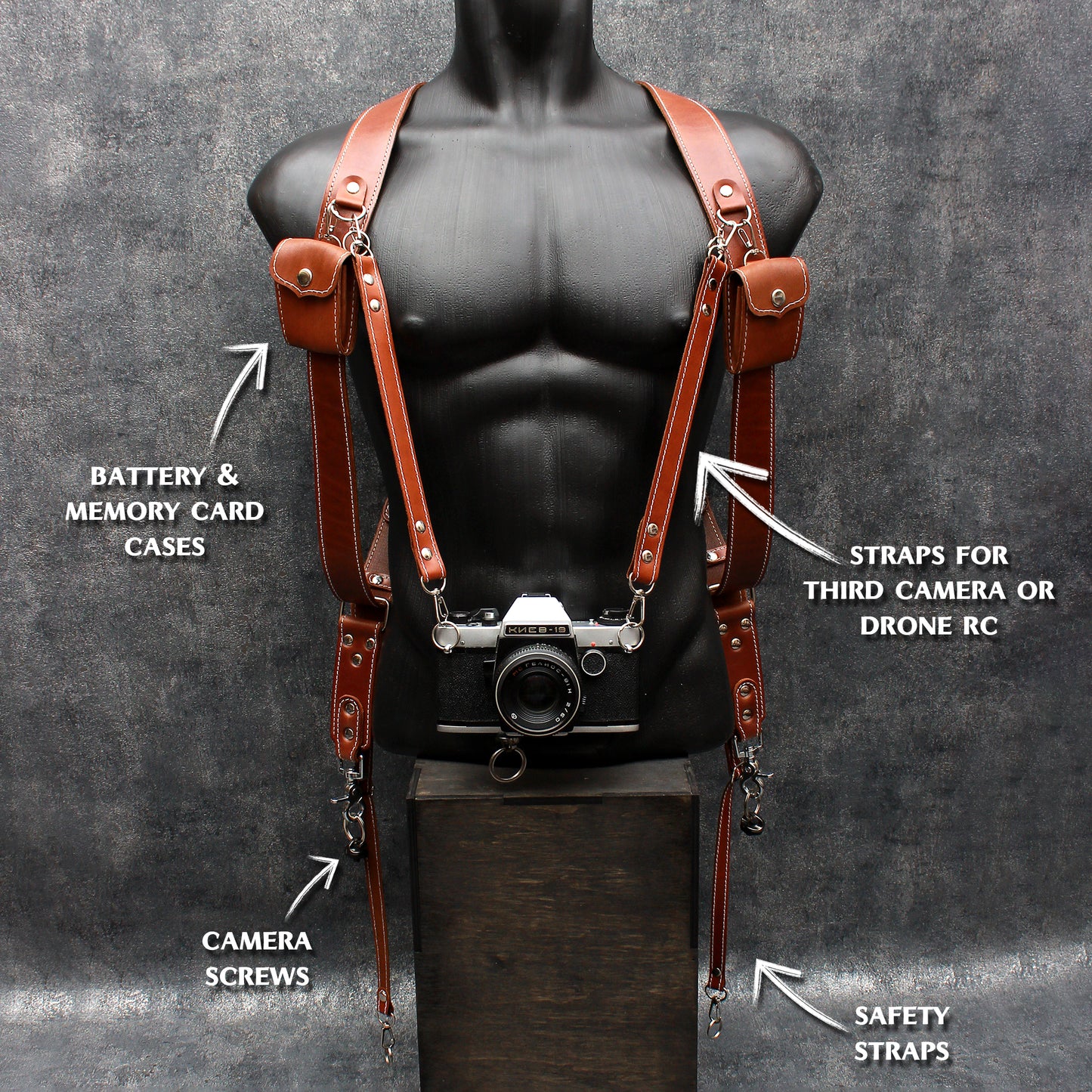 Dual camera strap (FULL LEATHER) with removable battery cases and a set of additional accessories.