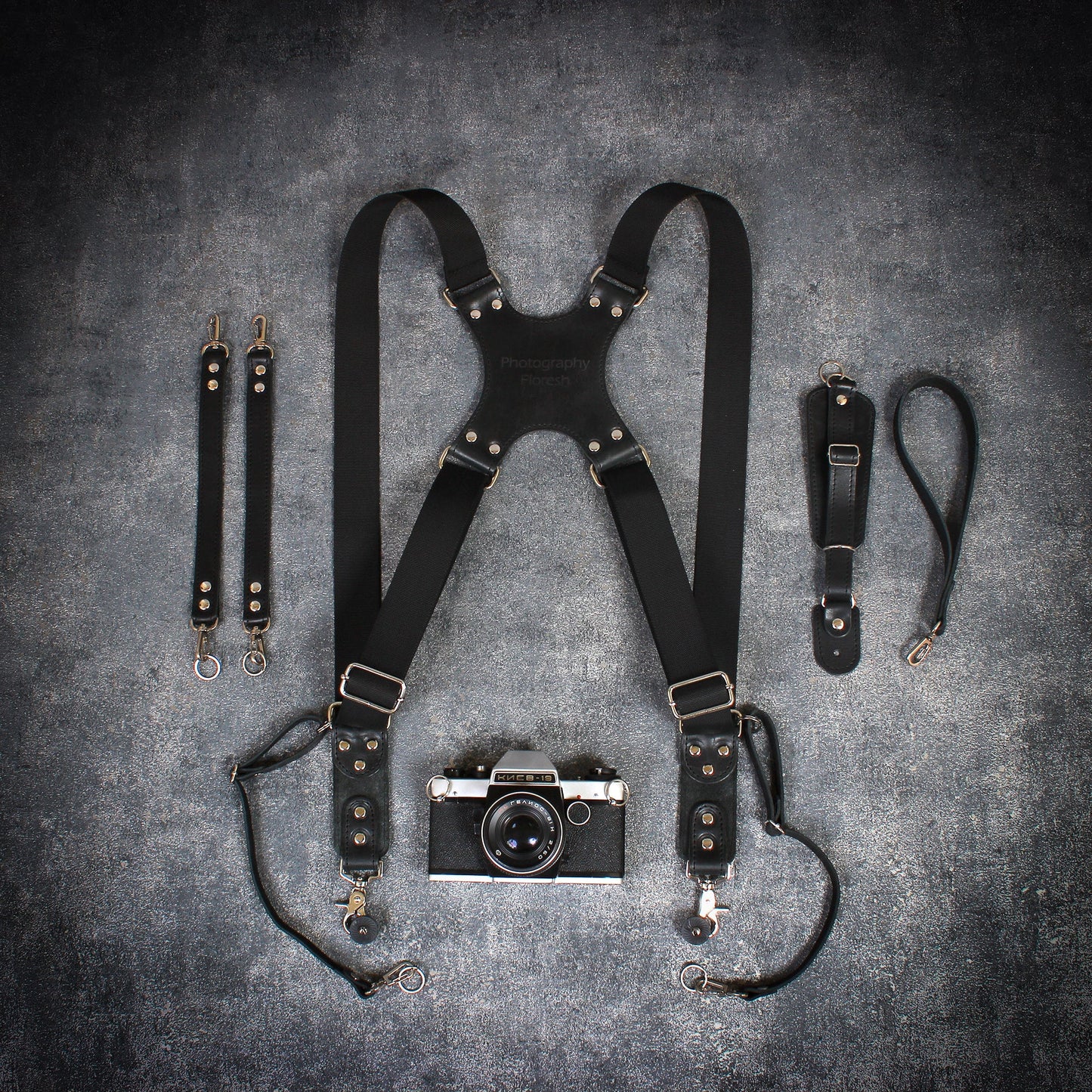 Dual camera strap with removable battery cases and a set of additional accessories. FREE SHIPPING.